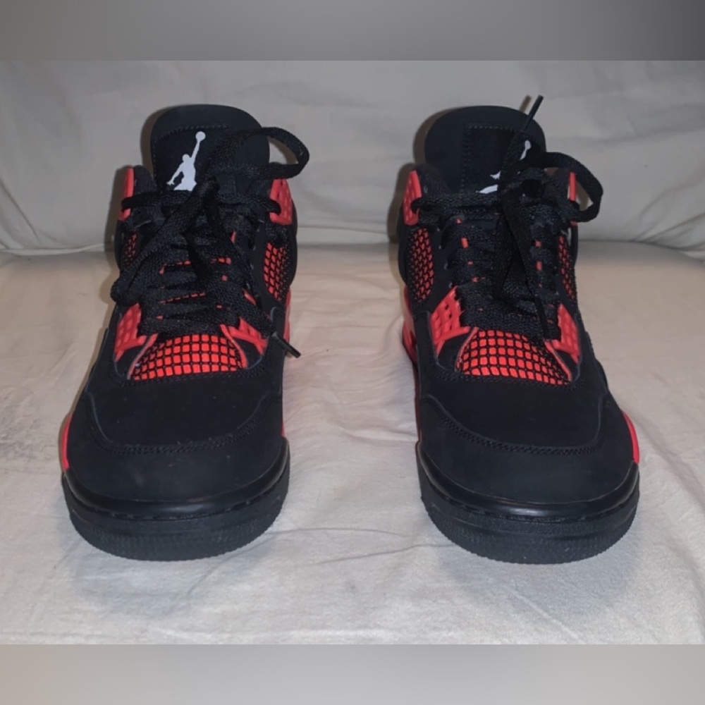Red thunder Jordan 4s, size 7.5 in men’s and 9 in women’s